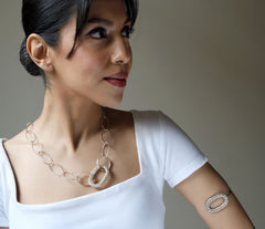 Oval Filigree Disc With Chain Links